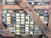 Another crate face with rows of labeled parts drawers; partially legible label visible in upper left