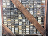 Bottom pallet section showing multiple rows of bins with assorted small parts visible through clear drawer fronts