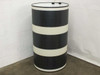 SoloPower flexible CIGS solar panel rolled into a cylinder shape — demonstrating full flexibility of the 86.75-inch panel, MC4 clips visible at top