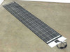 Solopower SFX1-35 35W flexible CIGS solar panel laid flat full length on floor showing all 30 cells and MC4 cable end