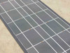Close-up of Solopower SFX1-35 CIGS cell surface showing grid lines and visible orange discoloration spots on several cells