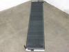 Solopower SP1 60W flexible solar panel laid flat showing full 86.5-inch length and dark CIGS cell surface with MC4 connector wire at bottom edge