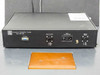 ECD Ovonics QA4-850-000 rear panel — PC Comm DB-9 port, Output Current connector, Mains Fuse 0A 250V IEC inlet, Vibrator 110VAC terminal, orange test pad visible below