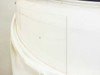 Close-up of glass roll edge showing thin glass sheet layers and edge of protective foam interlayer