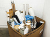Large cardboard pallet box packed with assorted solar panel PV encapsulation film rolls — white, gray, black, and brown cardboard core rolls visible, some in blue plastic bags