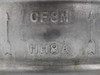 Close-up of Davis 1563 body casting markings: CF8M material designation and HH8A heat/casting code with flow direction arrows
