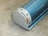Close-up of end cap on blue projection screen housing showing surface rust and paint wear on the metal cap