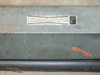 Da-Lite Model C label close-up on steel housing showing brand logo and rust spots on case exterior