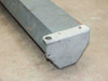 Da-Lite Model C end cap detail showing steel housing corner with mounting holes and surface rust