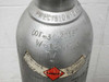 Shoulder of aluminum gas cylinder showing DOT-3AA2015 specification stamp, tare weight W=164383, TW markings, and flammable hazard label