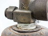 Close-up of CGA 580 valve outlet port and DL stamp on brass valve body