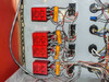 Technics West PE-IIGM Mass Flow Module interior close-up of four red relay modules with orange capacitors and associated control wiring