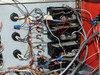 Technics West PE-IIGM Mass Flow Module interior right-side detail showing four stacked black control modules with multi-conductor wiring connections