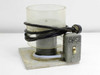 Unbranded CD DVD spin coater spinner chamber front view showing clear bowl, motor, BASE-labeled switch box, and white base plate