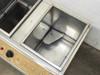 Right bath tank interior close-up showing stainless steel walls and agitator paddle insert