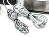 Tara Systems TR-1 load cell and interface cables coiled and zip-tied, showing bare wire ends on one cable and connector on the other