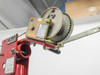 Thern M4022PB-K Crane Winch close-up – gear mechanism and cable drum with warning label, mounted on boom head