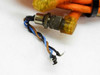 Damaged M12 connector end with bare brown, blue, and black wires frayed and exposed