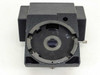 Top-down view of binocular microscope head block showing large circular swivel ring with internal optics and central aperture