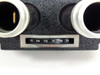 Close-up of IPD interpupillary distance scale on microscope head block, graduated 68 69 70 71 72 73 mm with red indicator at 71