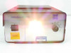 Volpi Intralux 6000 – front panel angled view with bright lamp output visible and asset/property tags on chassis