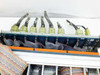 Top-down view of First Light Technology chassis showing rear multi-pin connectors and internal ribbon cable routing on backplane