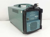 Tektronix T922 rear view — teal portable enclosure with carry handle, ventilation grille, power cord, and rear panel caution label visible