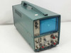 Tektronix T922 15MHz portable oscilloscope — three-quarter front view showing teal enclosure, CRT display, carry handle, and front panel controls