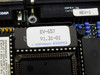 Close-up of Everex EV-657 BIOS/firmware chip label reading 'EV-657 V1.31-01 Copyright Everex' with REV-1 board revision label visible nearby