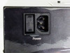 Close-up of IEC C14 power inlet and rocker switch on rear panel of Triad Solutions Dual-Dewar Vacuum Controller
