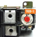 Hitachi TR80B-1E relay close-up of dial showing 80–70–55A setting range, red reset button, and trip indicator