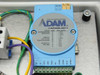 Close-up of Advantech ADAM-4011 Data Acquisition Module label showing input codes for thermocouple, mV, V, mA, and RS-485 output