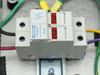 Close-up of Ferraz Shawmut UltraSafe USCC21 Class CC fuse holder on DIN rail inside enclosure