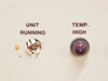 Close-up of Unit Running indicator socket (lamp missing) and Temp High indicator light on front panel