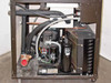 Interior compressor compartment showing compressor, condenser coil, accumulator, and copper refrigerant lines