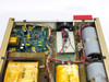 Interior side-angle view of TCR 150S7 DC power supply showing control PCB, power transistor assembly, transformers, and wiring harness