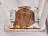 Lower pressing platform showing heavy surface rust and oil staining on the platen between the four guide posts