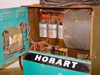 Interior view of Hobart 1R6-504 charger with side panel open, showing transformer, capacitors, and internal wiring