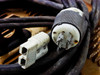 Hobart 1R6-504 power cables showing Anderson-style 2-pin battery output connector and locking AC input plug