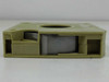 16mm microfilm cartridge — side view showing internal film roll visible through open housing slots
