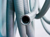 Close-up of flexible steel armored conduit coils attached to the Thermotron Console chamber controller