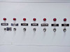 Lower front panel of Thermotron Console controller showing seven indicator lights and toggle switches: Vibration, Auxiliary Cool, Cooling, Heating, Circulator, Light, and Pilot