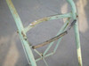Harper Trucks hand truck close-up of upper frame and chain restraint bar showing rust and wear on cross-member and bungee/chain hooks