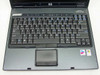 HP Compaq nc6230 – top-down view of keyboard and touchpad with Compaq nc6230 badge visible on lid