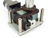 1U-211-008-P160 indexing drive assembly – side view showing output disk, sensor/switch bracket, and vertical output shaft with bearing race