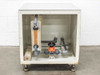 Interior view of water filtration enclosure showing Advantec filter housing, rotameter flowmeter, PVC ball valve, and gray PVC plumbing