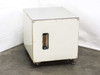 Custom water filtration enclosure front view showing painted white steel cabinet on leveling feet with flowmeter window cutout on front panel