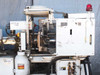 Sumitomo SD30 injection molder – right-side view with Yushin DRD II-HS robot arm visible and control cabinet