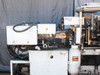 Sumitomo SD30 injection molding machine – left-side view showing Yushin DRD II-HS robot arm label and mold area