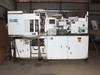 Sumitomo SD30 injection molding machine – wider view inside warehouse showing full machine profile with control panel